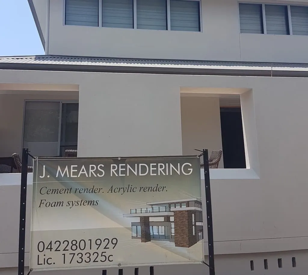 J Mears Rendering site banner hung on a freshly rendered Central Coast build
