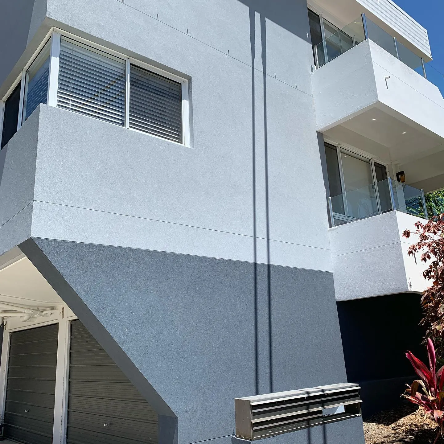 Rendered apartment building with white balcony detailing
