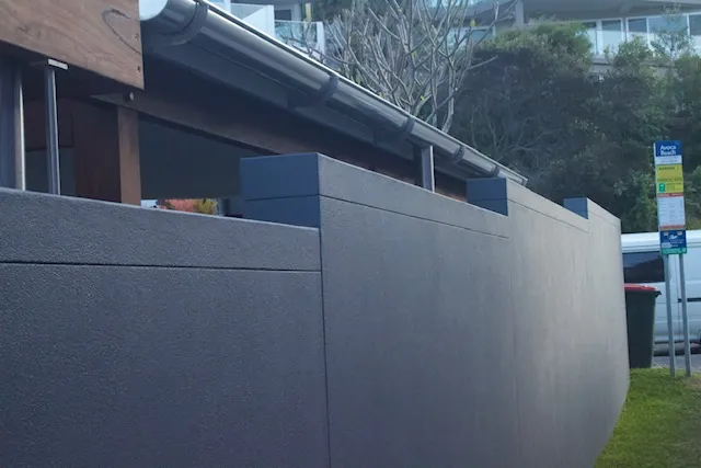 Textured charcoal rendered front wall on an Avoca Beach property