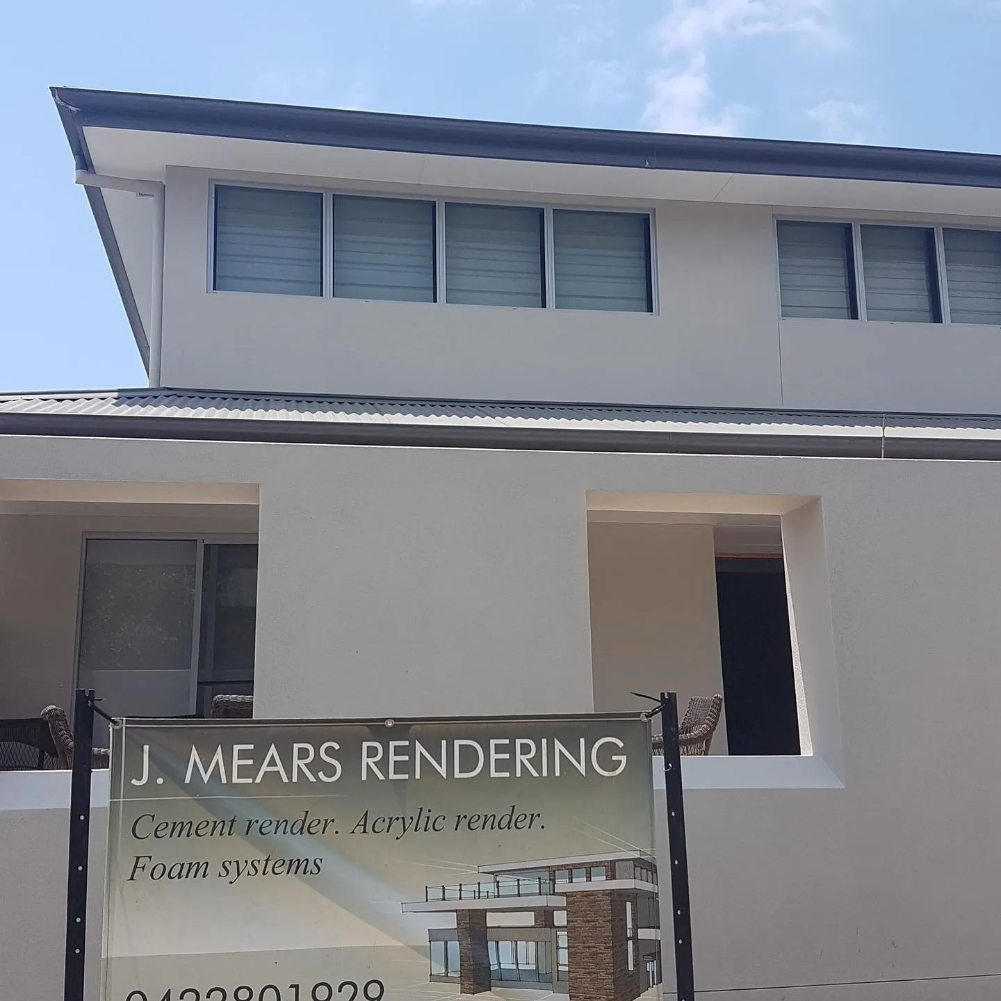 J. Mears Rendering site signage in front of a freshly rendered home
